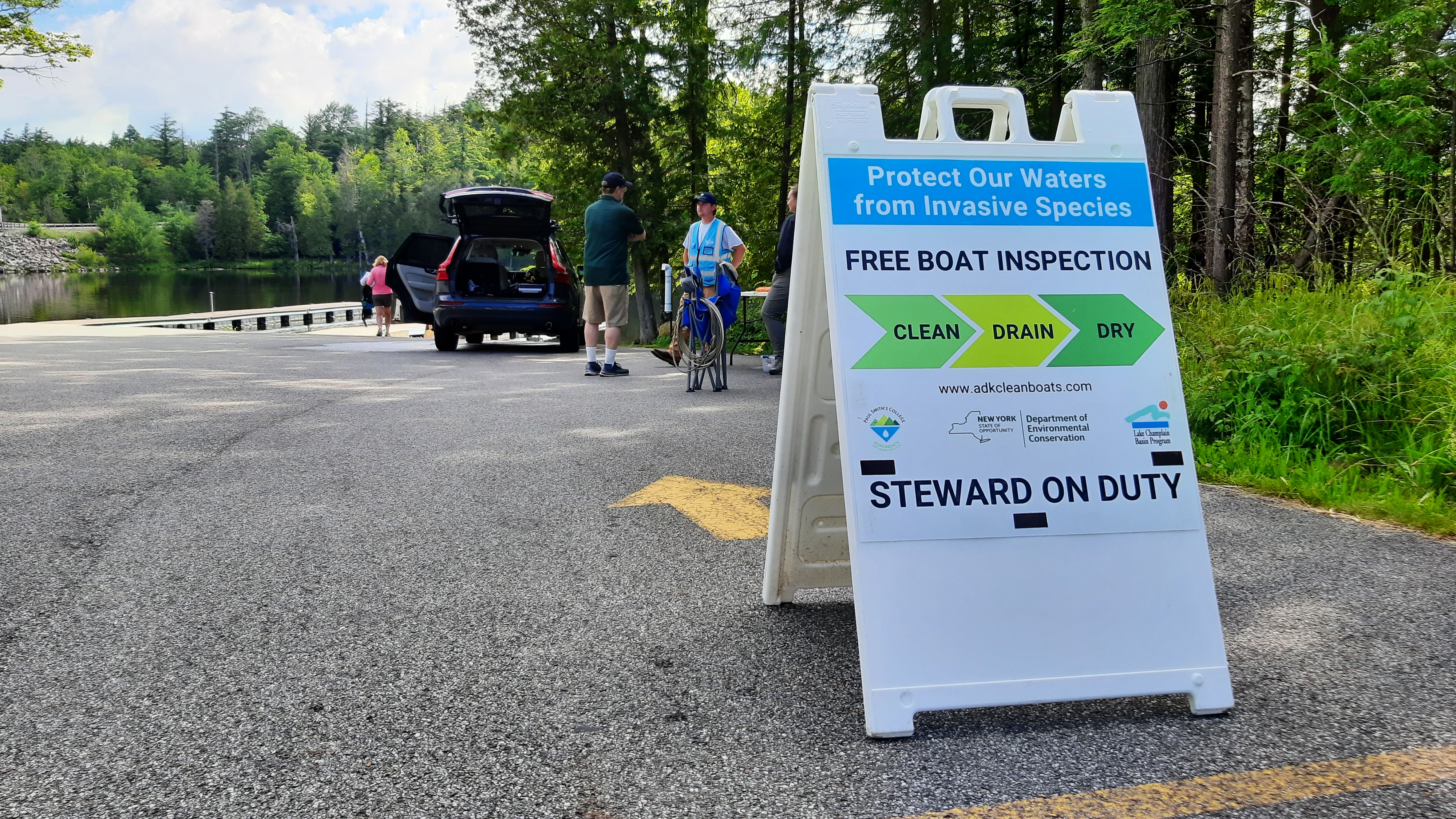 A watershed steward speaks with boaters