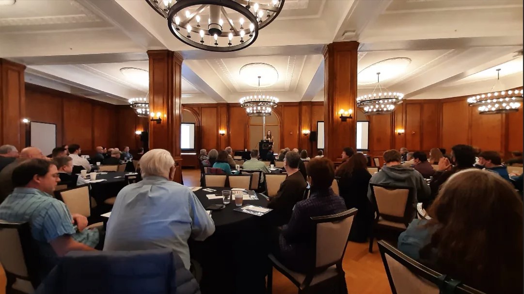 People attend the APA conference in Saranac Lake