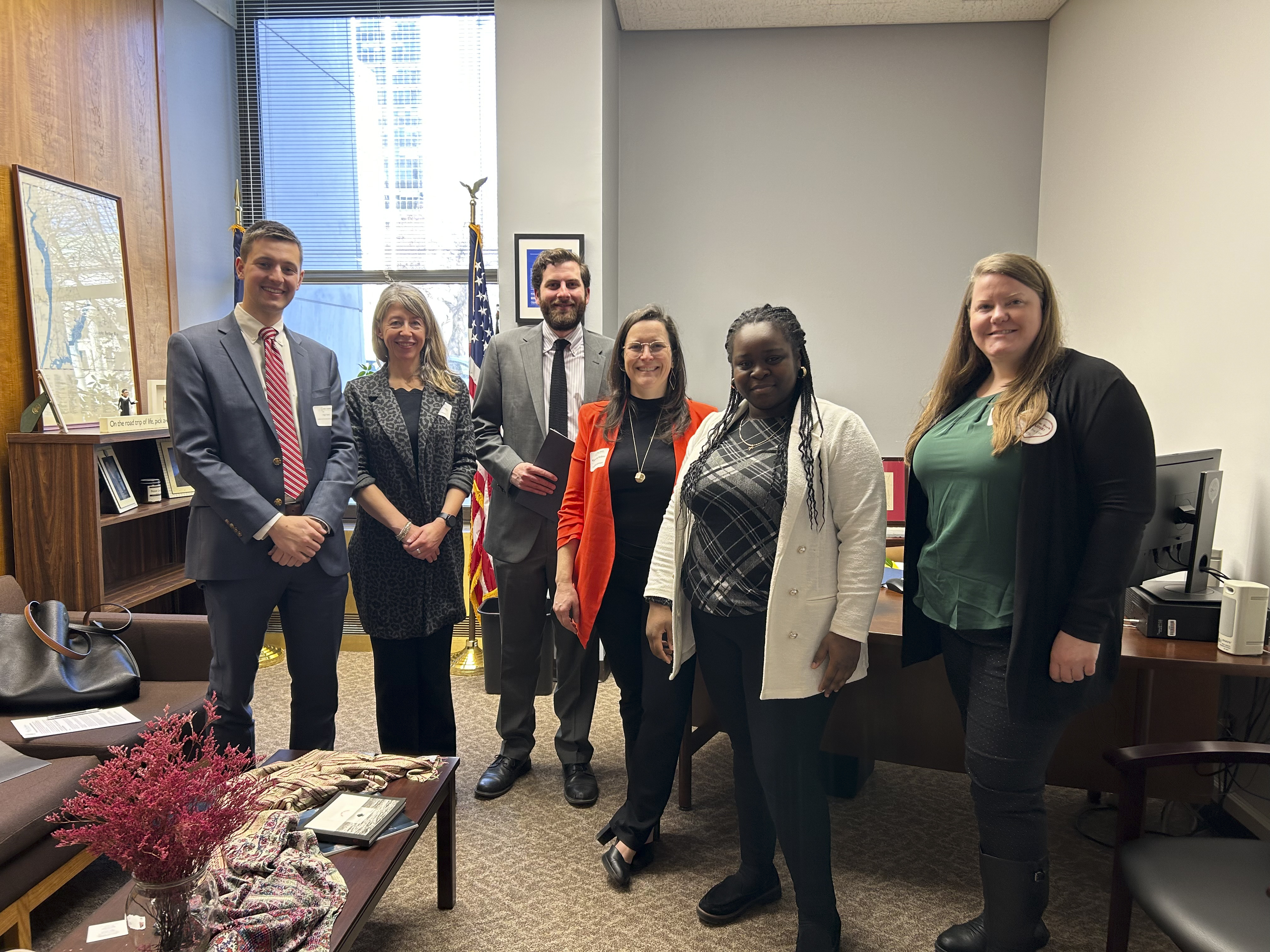 Staff and elected officials with Council intern James Emmenegger