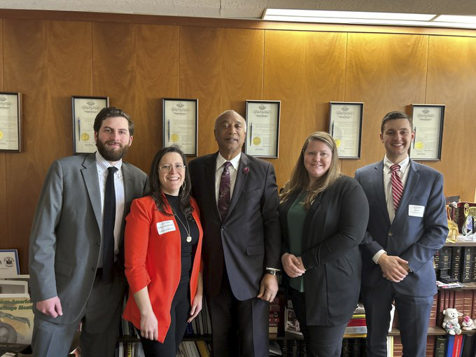 James Emmenegger with elected officials and staff in Albany