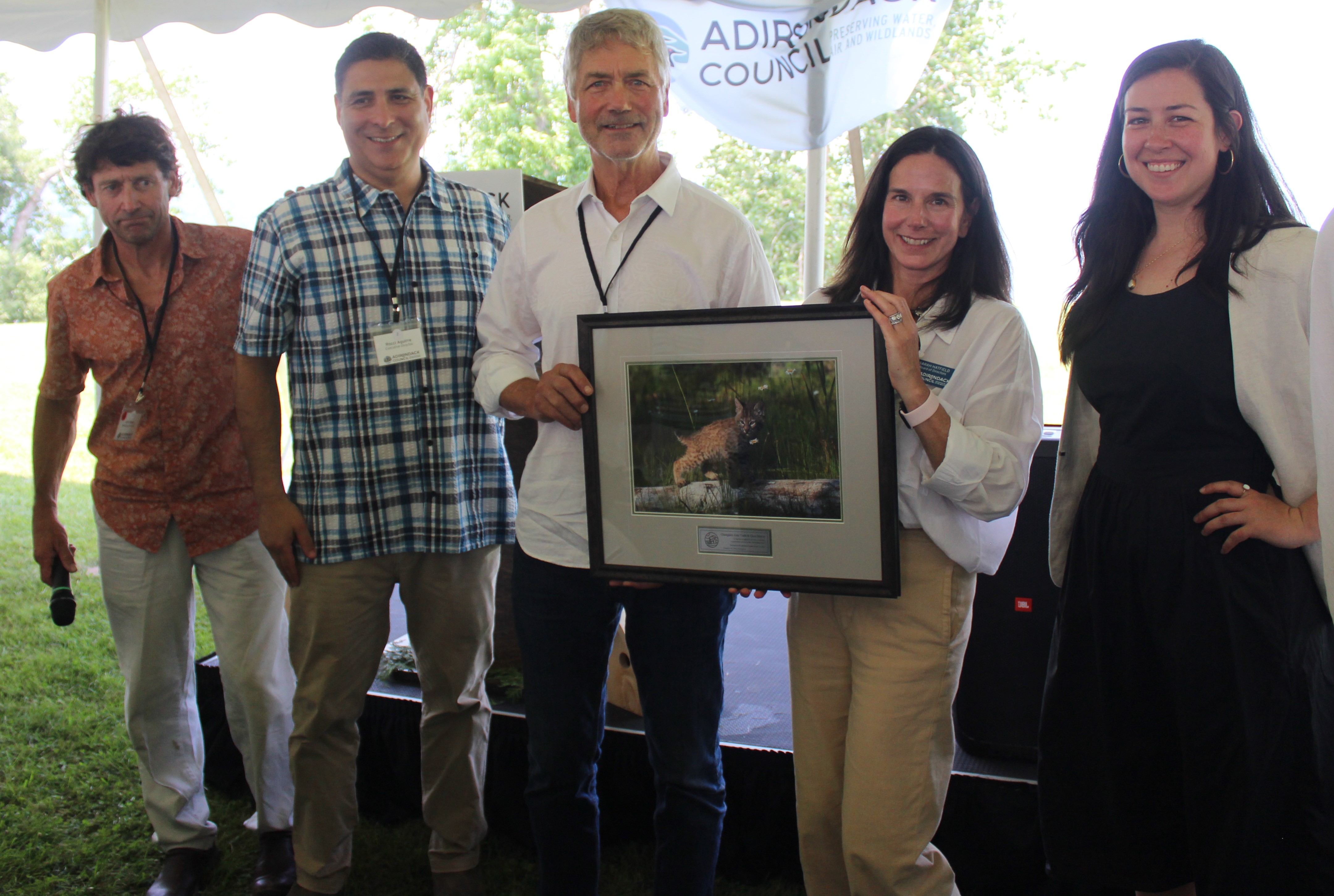 Chris Maron, center, accepts his and CATS special award