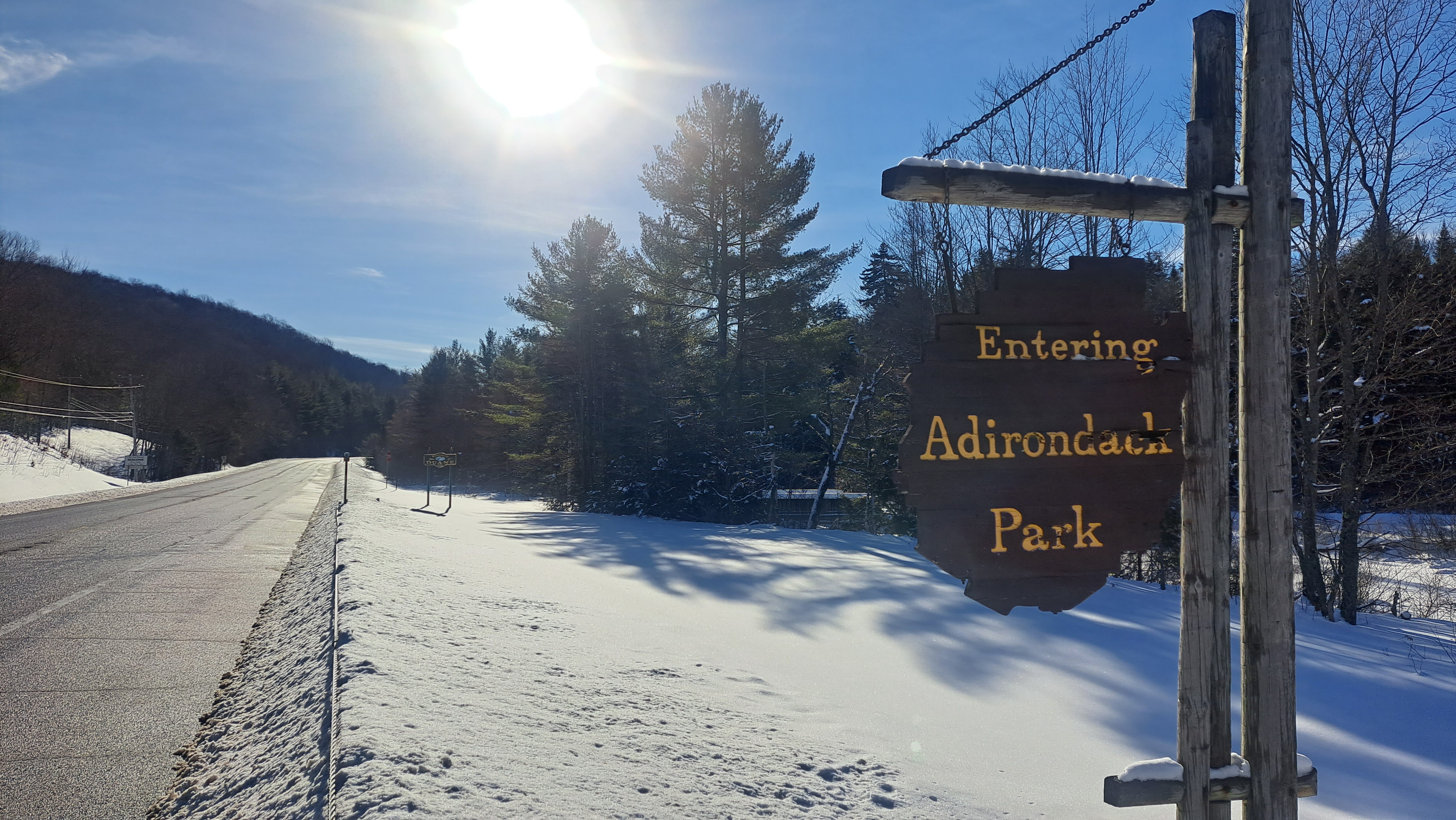 a sign welcomes people to the Adirondack Park