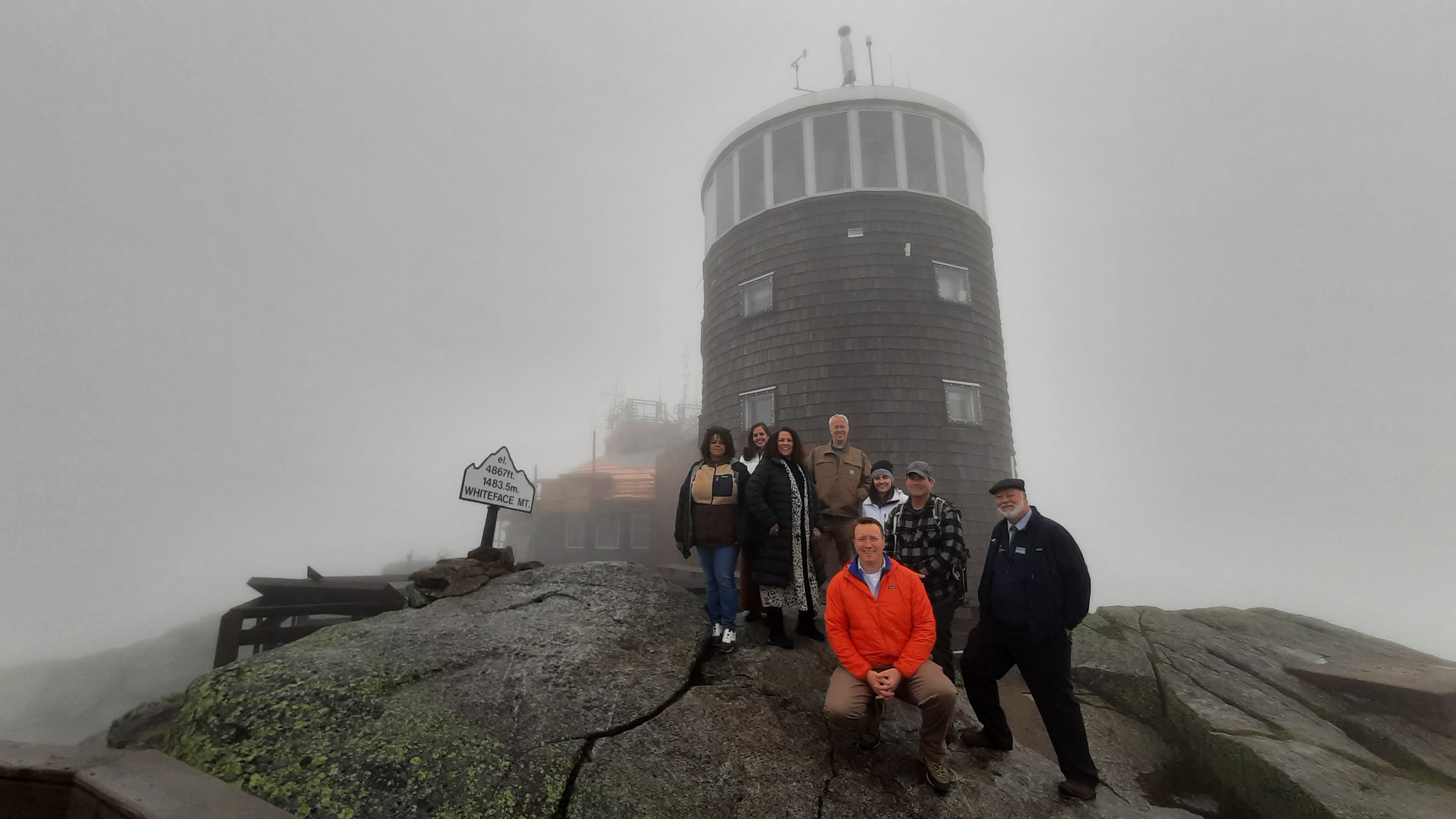 People at the summit of Whiteface Mountain, where there is a large air monitoring station and equipment