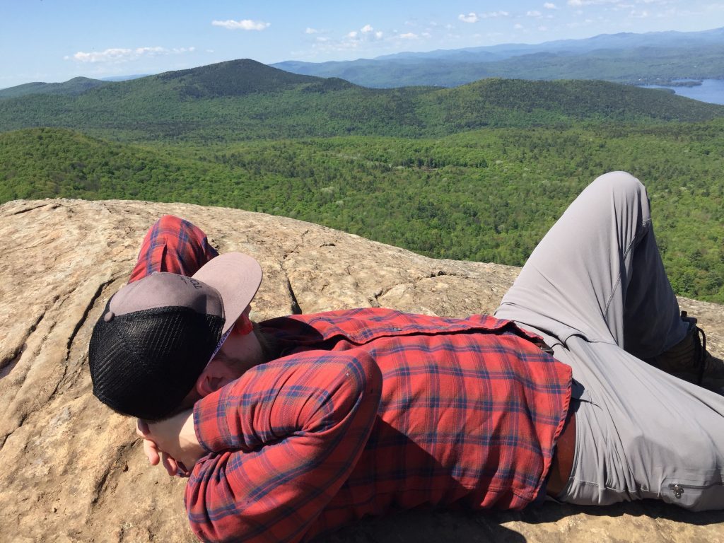 Andrew Williams relaxing on an Adirondack mountain